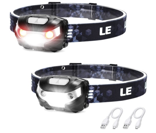 Product shots of the LE headlamp shows red lighting on one setting and bright white on another. There are also two white cables at the bottom that are included for charging.