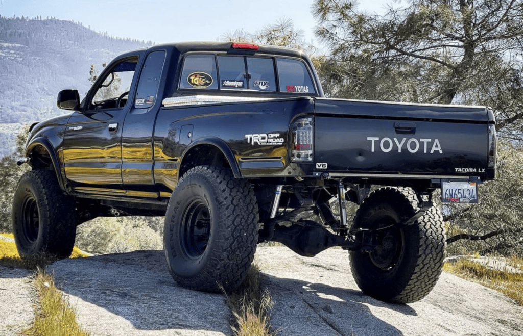 Black lifted 1st gen Toyota Tacoma